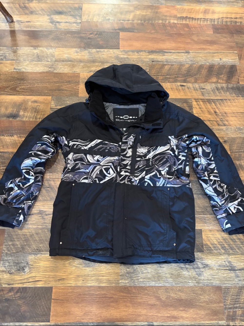 Obermeyer Kids Black Jacket with White and Blue Graphic Panels‎